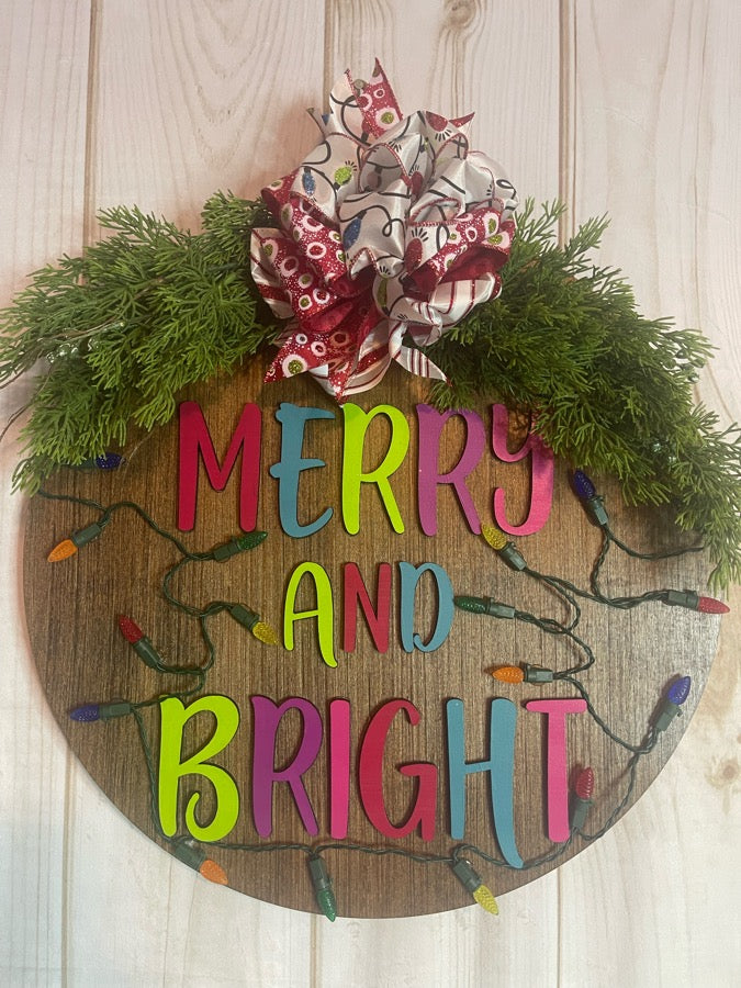 Merry  and Bright Lighted Christmas Round Wood Door Hanger with Greenery